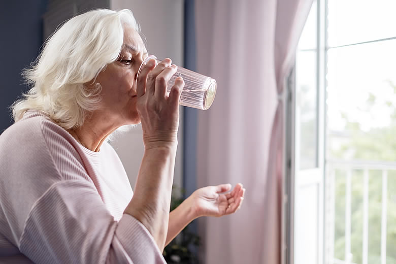 Woman Taking Vitamins